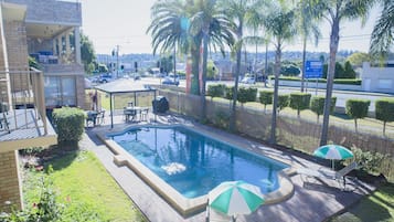 Outdoor pool, pool umbrellas, sun loungers