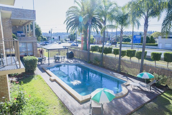 Outdoor pool, pool umbrellas, sun loungers