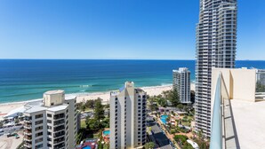 A high-rise hotel with multiple floors, a beach view, and a pool area. - Mantra Legends Hotel (Surfers Paradise)