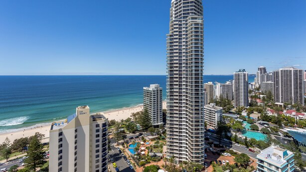 A high-rise hotel with a beach view, multiple balconies, and a swimming pool. - Mantra Legends Hotel (Surfers Paradise)