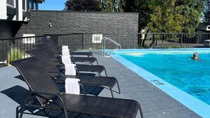A swimming pool area with lounge chairs and a building in the background. - The Vic, an Ascend Collection Hotel (Victoria)