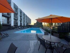 Outdoor pool, open 9 AM to 9:00 PM, pool umbrellas, sun loungers