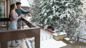 A balcony with a view of snow-covered trees. - Whistler Village Inn And Suites (Whistler)