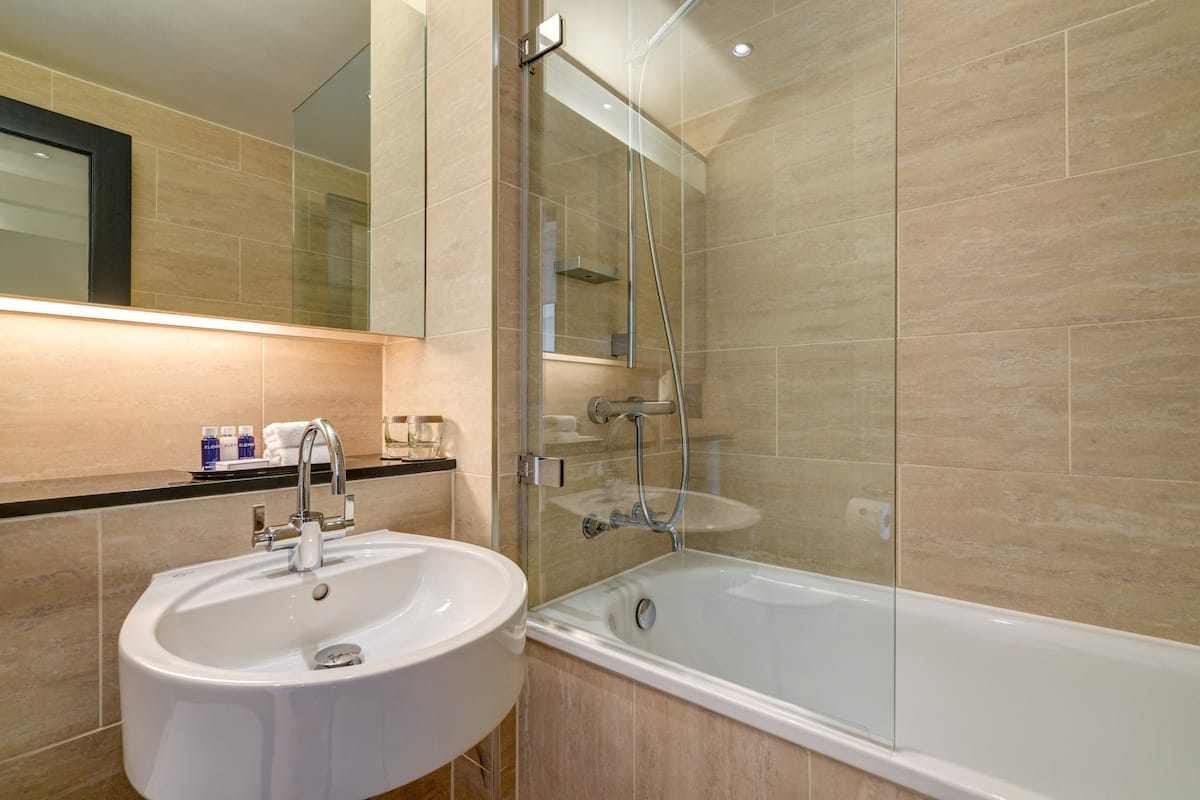 city twin room | bathroom | eco-friendly toiletries, hair dryer, towels, soap