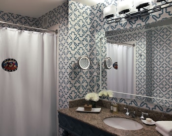 Combined shower/tub, designer toiletries, hair dryer, bathrobes at Kimpton Hotel Monaco Seattle, an IHG Hotel