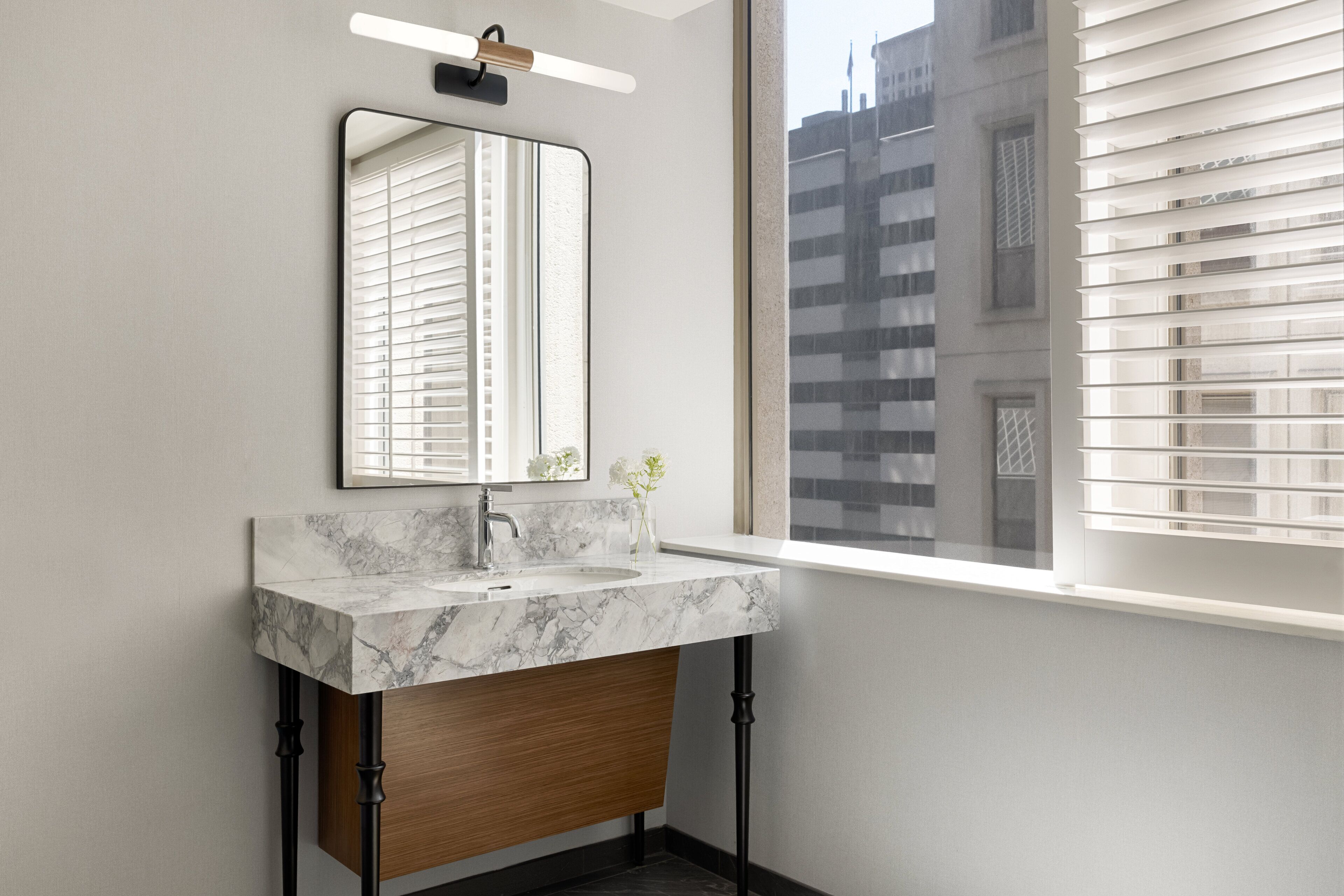 combined shower/bathtub, designer toiletries, hair dryer, bathrobes