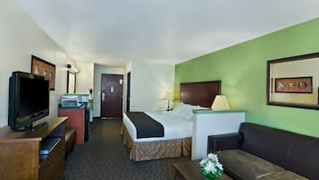 Premium bedding, desk, laptop workspace, blackout drapes