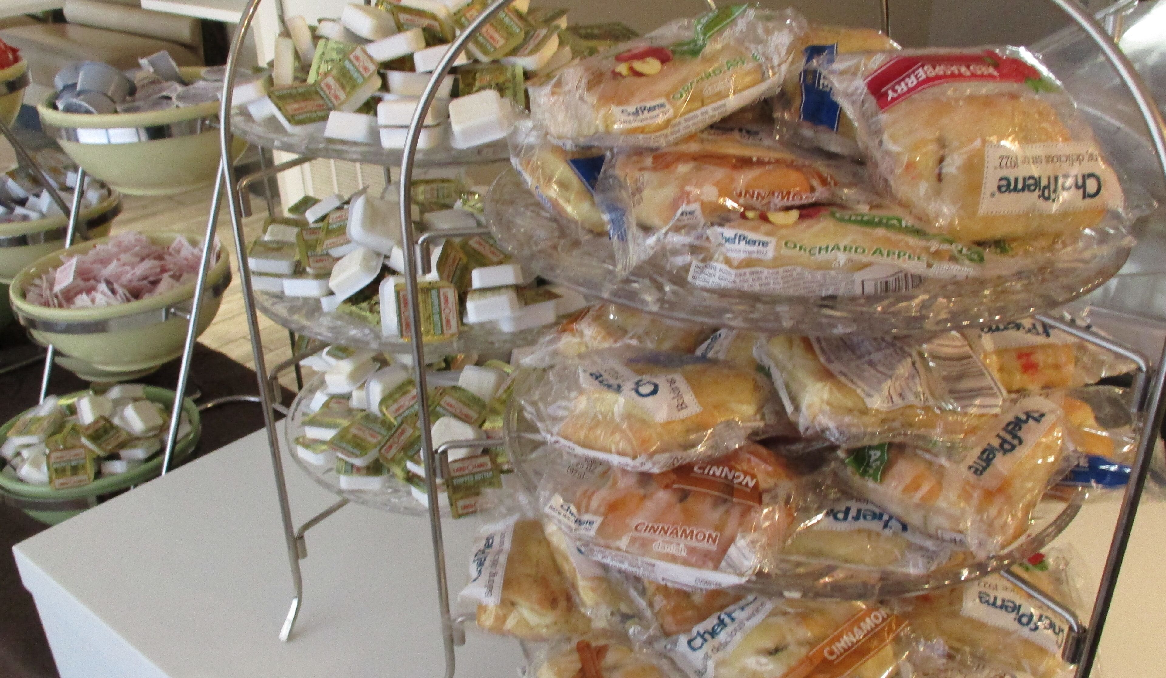 A display of packaged sandwiches on a metal stand.