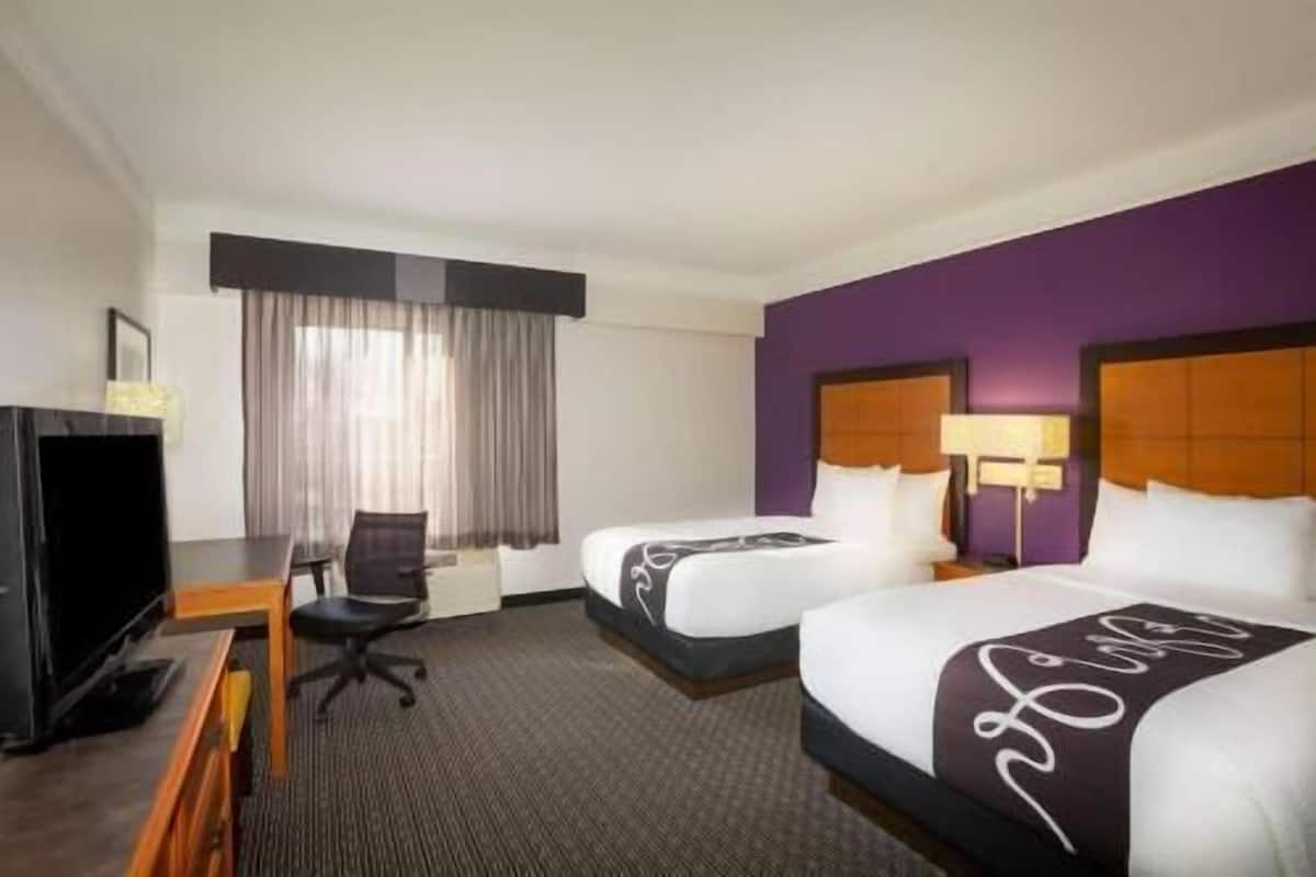 Premium bedding, desk, laptop workspace, iron/ironing board