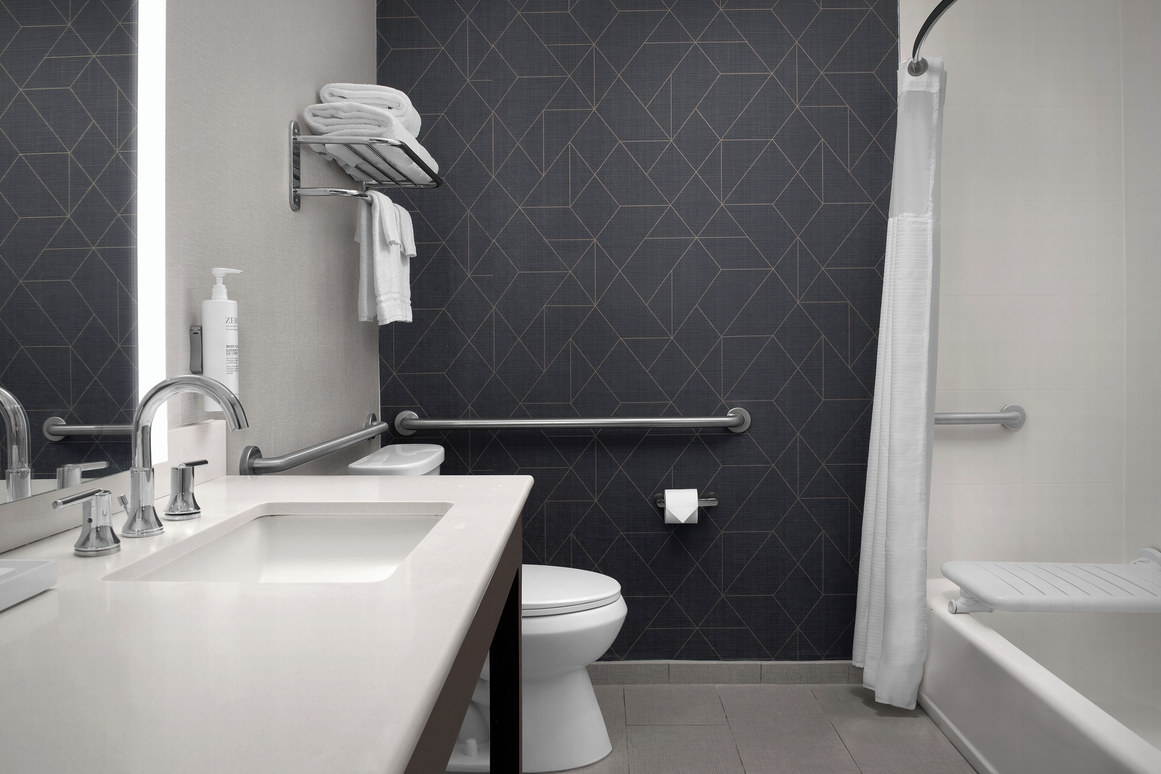 2 bedroom suite accessible tub | bathroom | hair dryer, towels, soap, shampoo