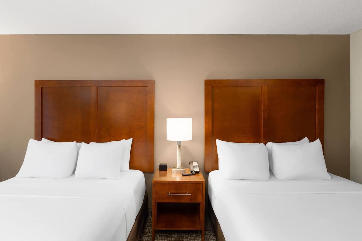 Room, 2 Queen Beds, Non Smoking | Desk, laptop workspace, blackout drapes, iron/ironing board