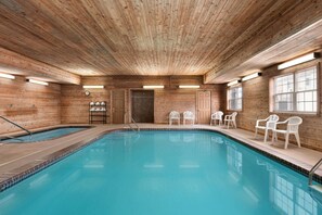 Indoor pool, open 8:00 AM to 10:00 PM, pool loungers