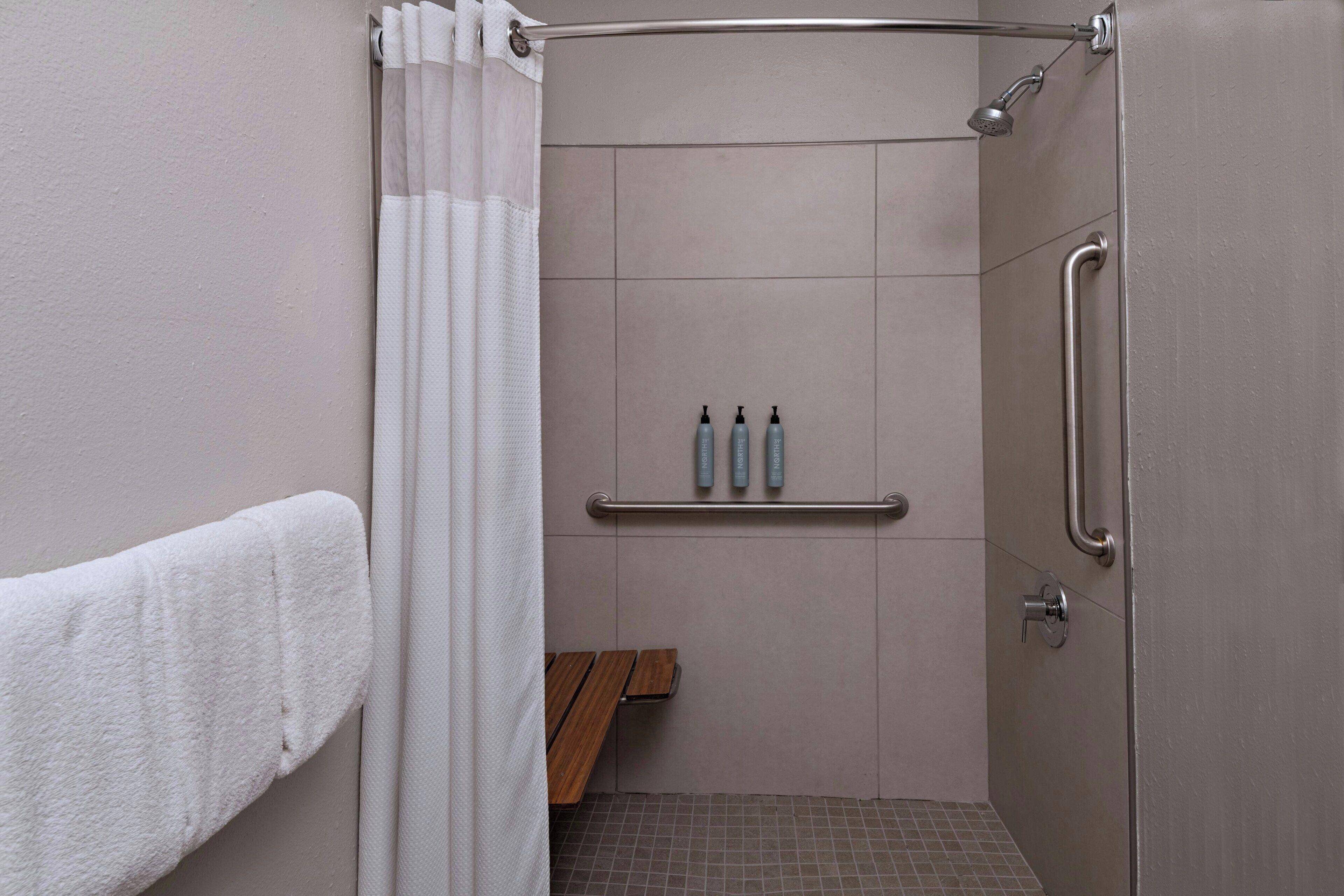 room, 1 king bed with sofa bed (mobility/hearing access, roll-in shwr) | bathroom | combined shower/bathtub, free toiletries, hair dryer, towels