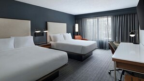 A hotel room with two beds, a desk, and a chair. - Courtyard Houston The Woodlands (The Woodlands)