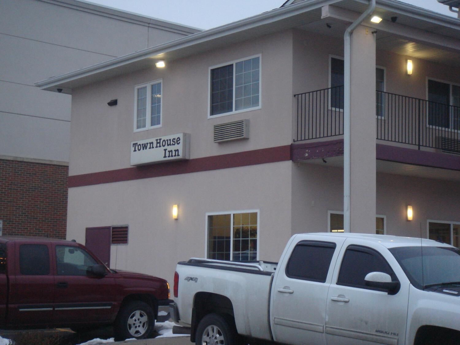 A building with a sign reading "Town House Inn".