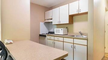 Full-size fridge, microwave, stovetop