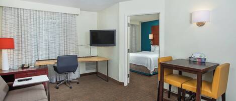 Desk, laptop workspace, iron/ironing board, free cribs/infant beds