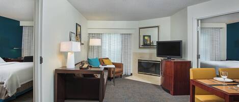 Desk, laptop workspace, iron/ironing board, free cribs/infant beds