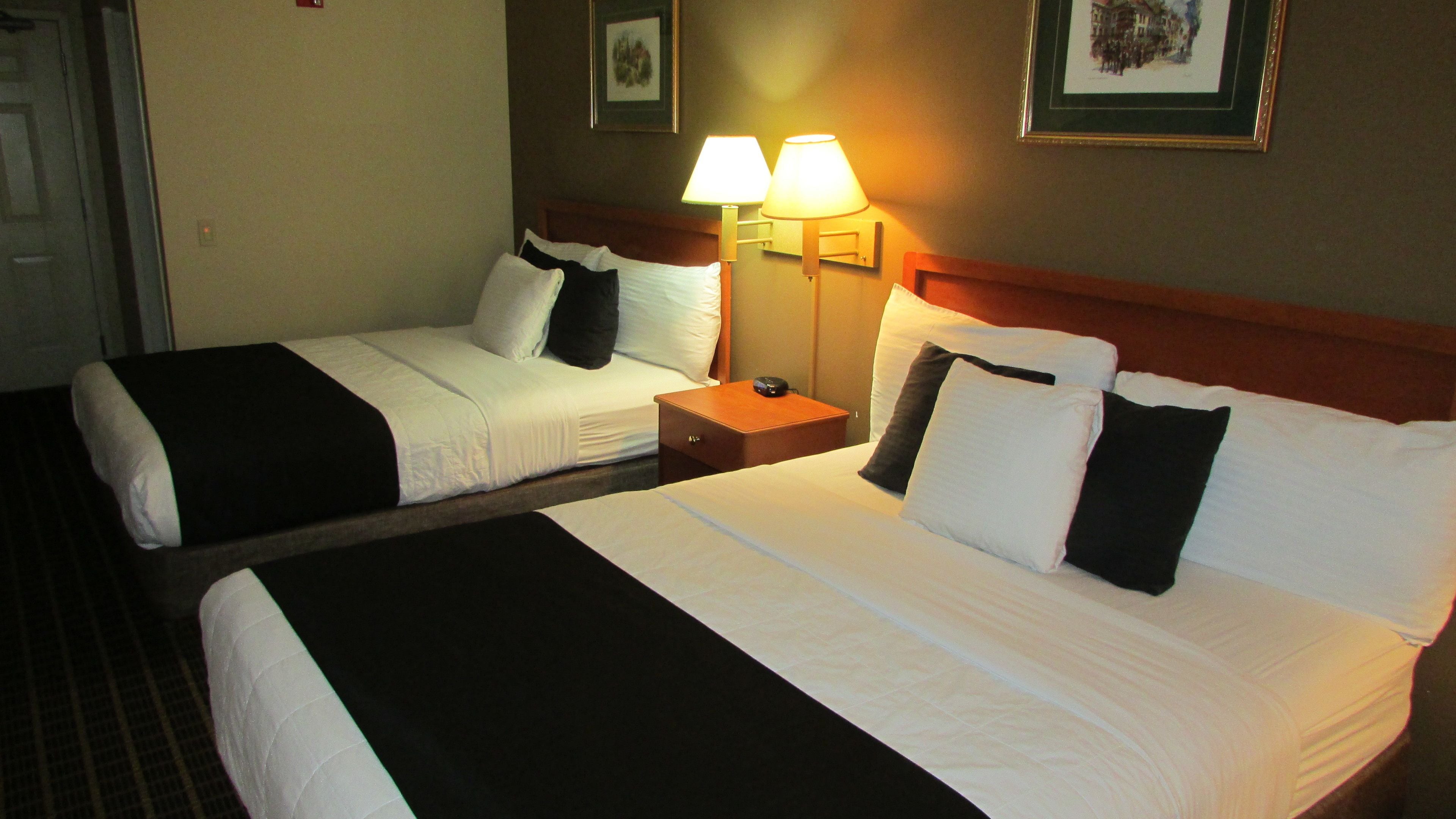 deluxe room, 2 queen beds | pillow-top beds, desk, blackout curtains, iron/ironing board