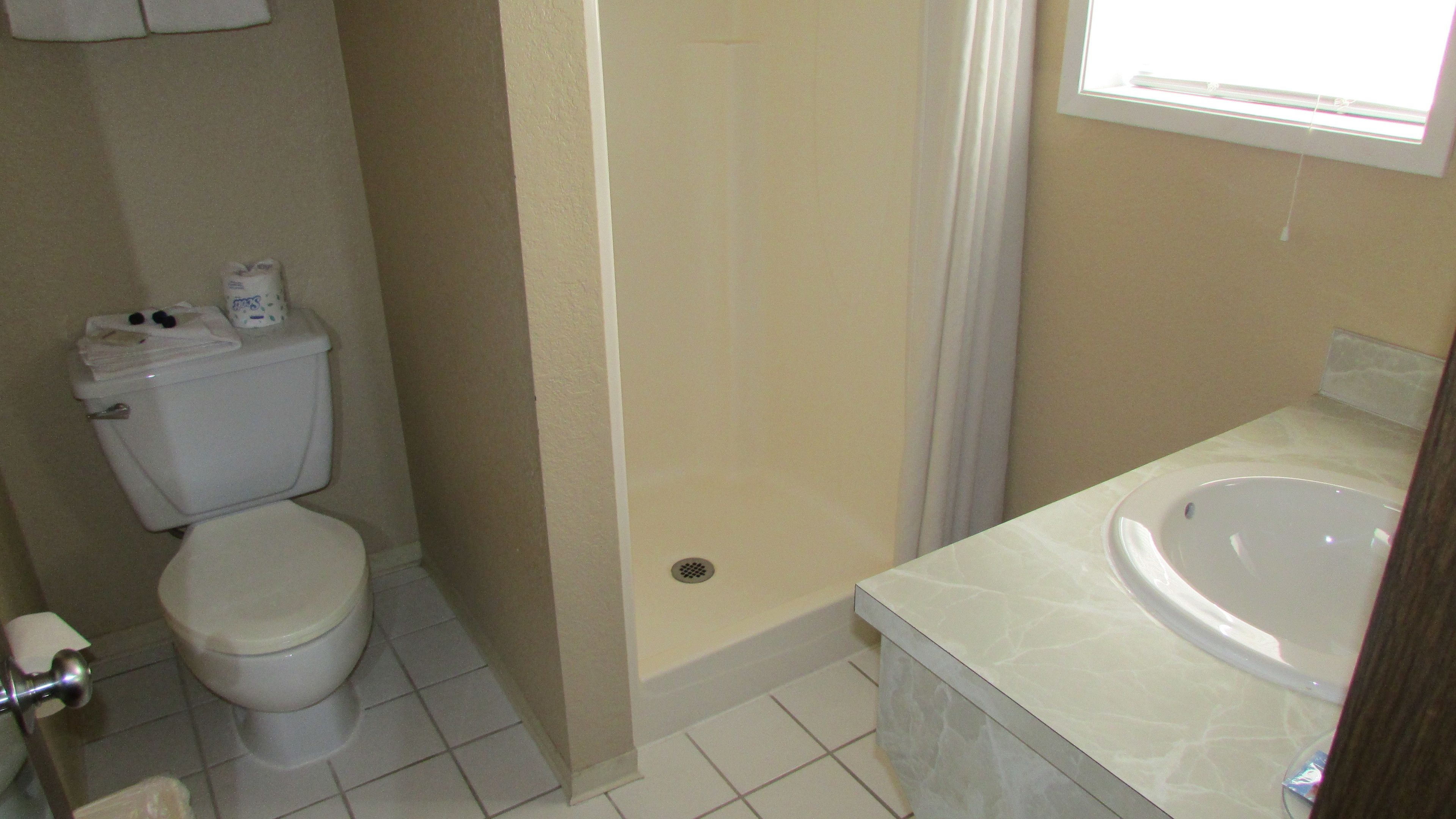 standard room, 1 king bed, non smoking | pillow-top beds, desk, blackout curtains, iron/ironing board