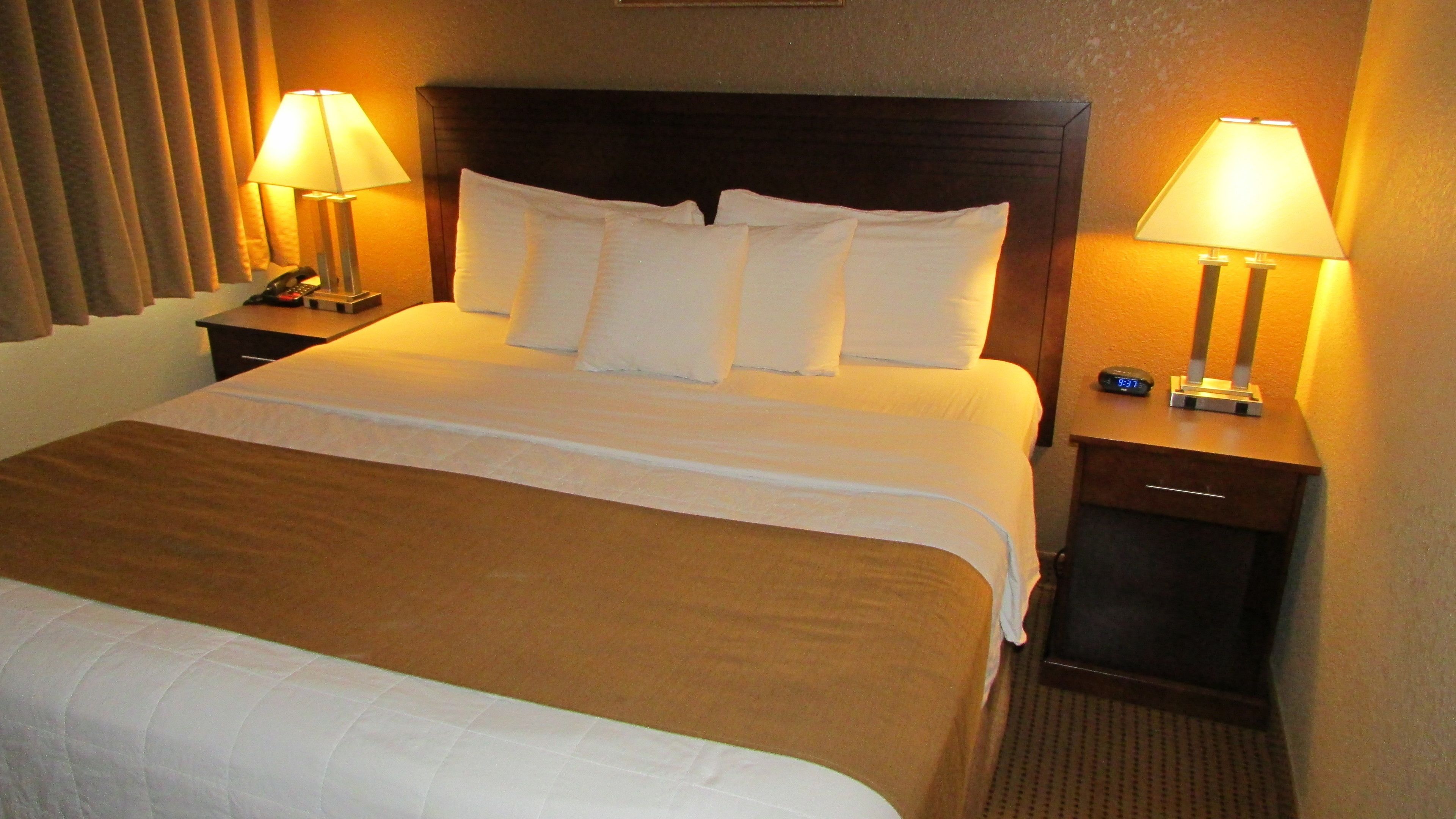 standard room, 1 king bed, non smoking | pillow-top beds, desk, blackout curtains, iron/ironing board