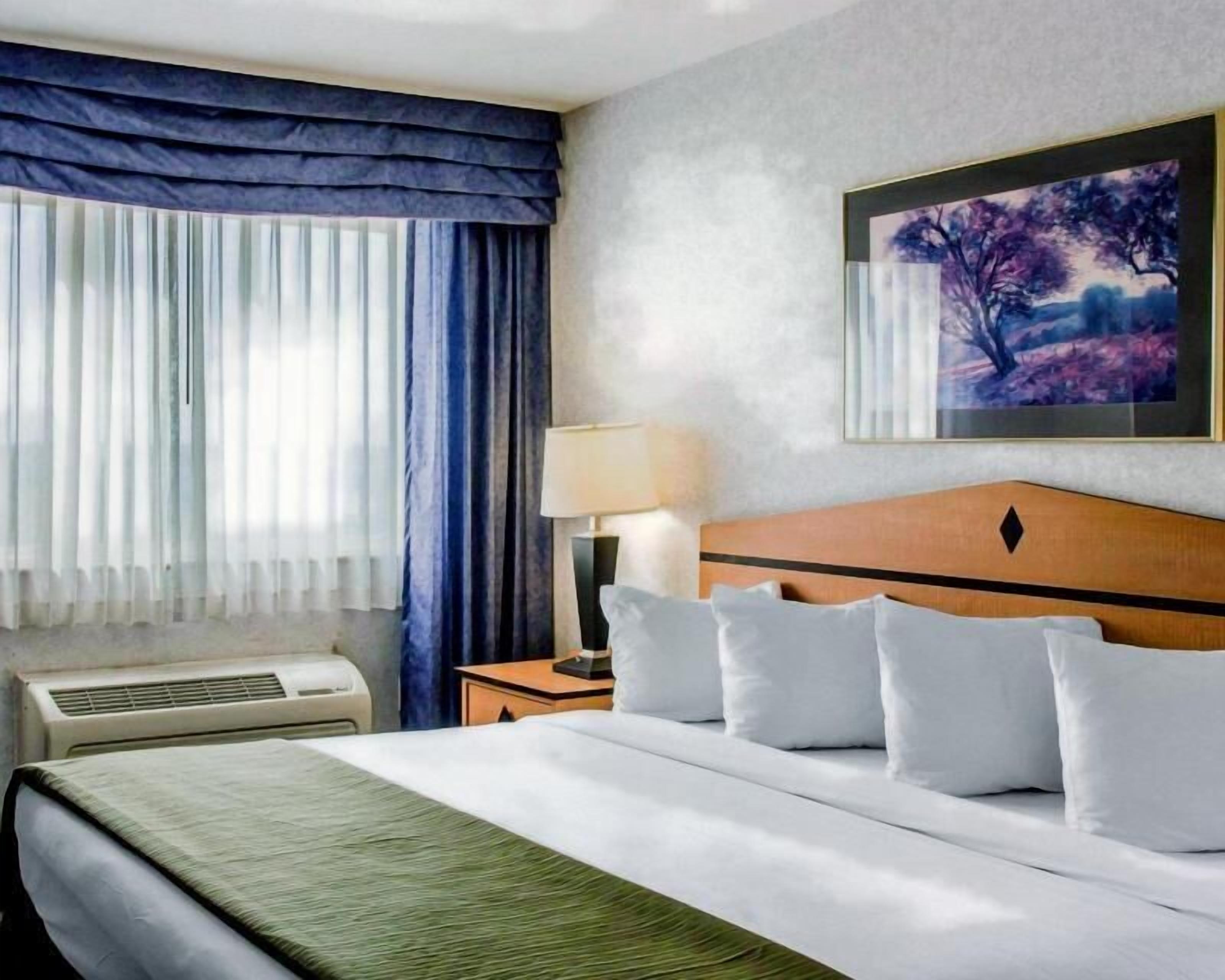 Desk, laptop workspace, blackout curtains, iron/ironing board