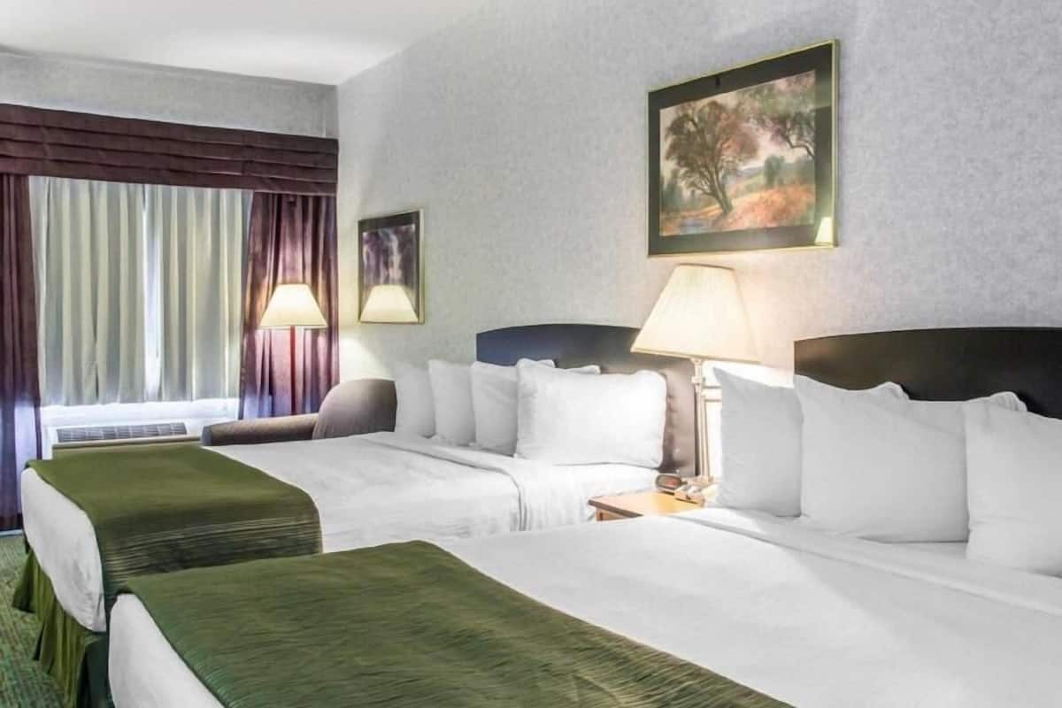 Desk, laptop workspace, blackout drapes, iron/ironing board