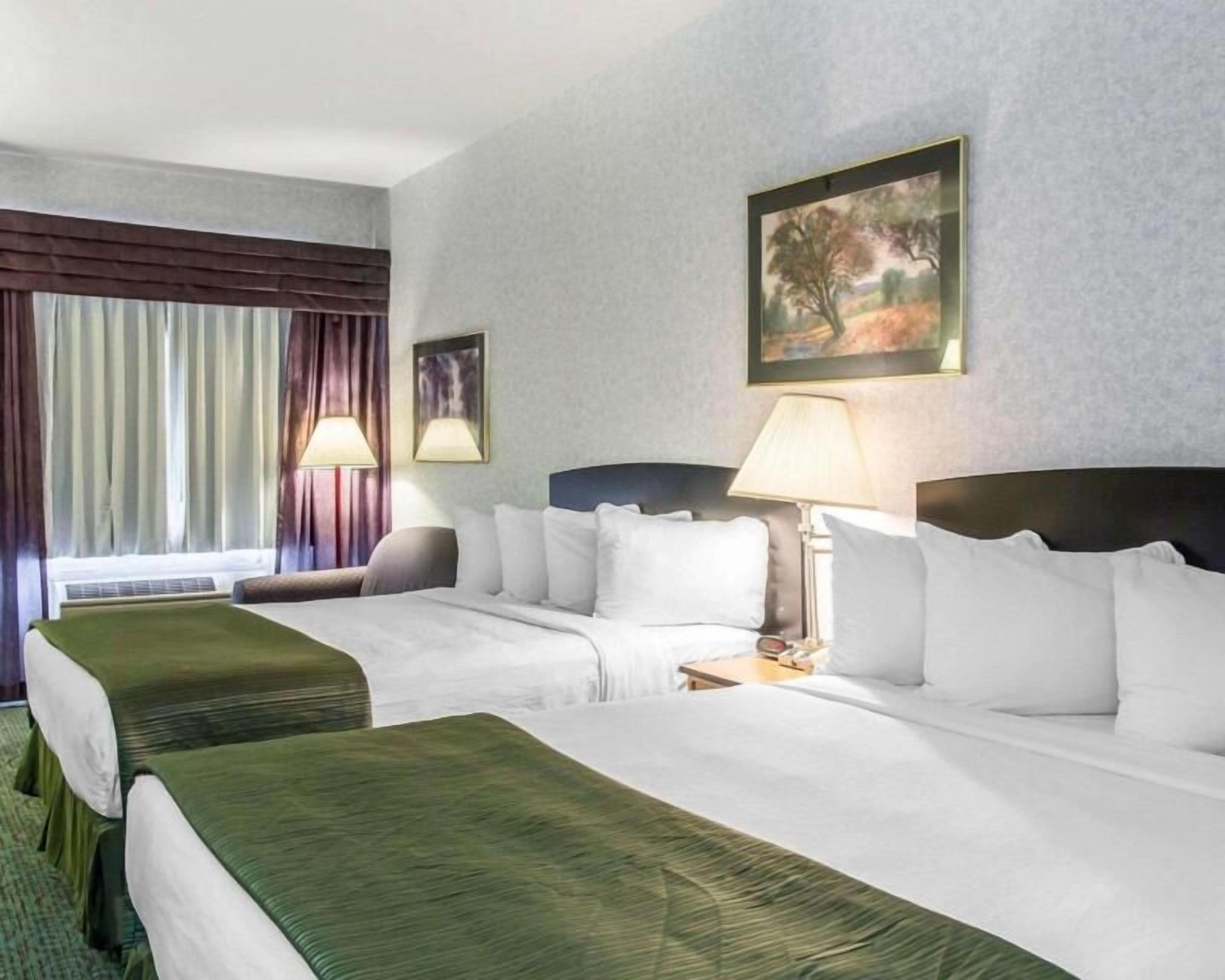 Desk, laptop workspace, blackout curtains, iron/ironing board