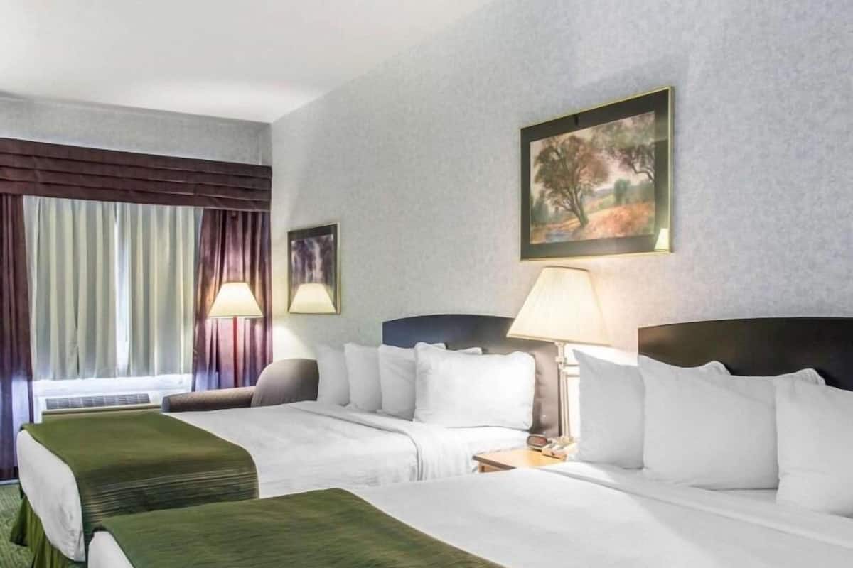 Desk, laptop workspace, blackout drapes, iron/ironing board