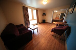 Junior Suite, 1 King Bed with Sofa bed, Refrigerator & Microwave | Living area