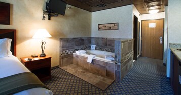Presidential Studio Suite, Hot Tub | Blackout drapes, iron/ironing board, free WiFi, bed sheets