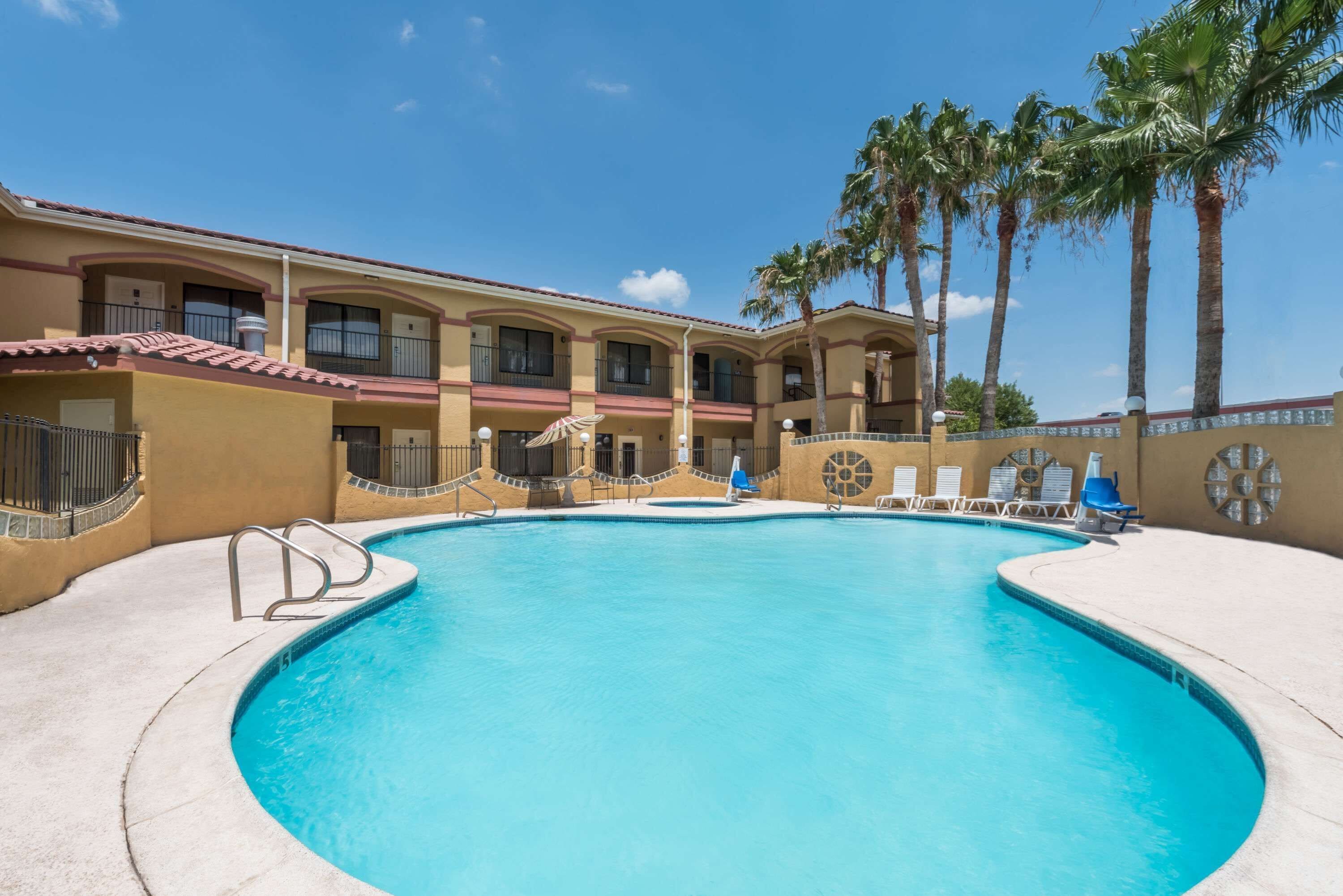 Outdoor pool, open 11:00 AM to 10:00 PM, pool umbrellas, sun loungers