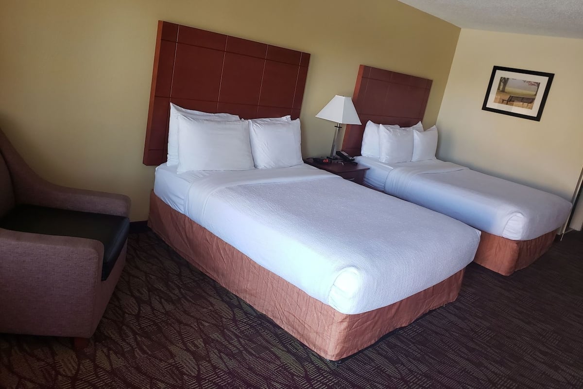 Desk, laptop workspace, iron/ironing board, cribs/infant beds