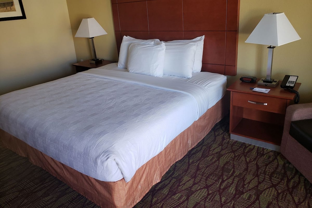 Desk, laptop workspace, iron/ironing board, cribs/infant beds