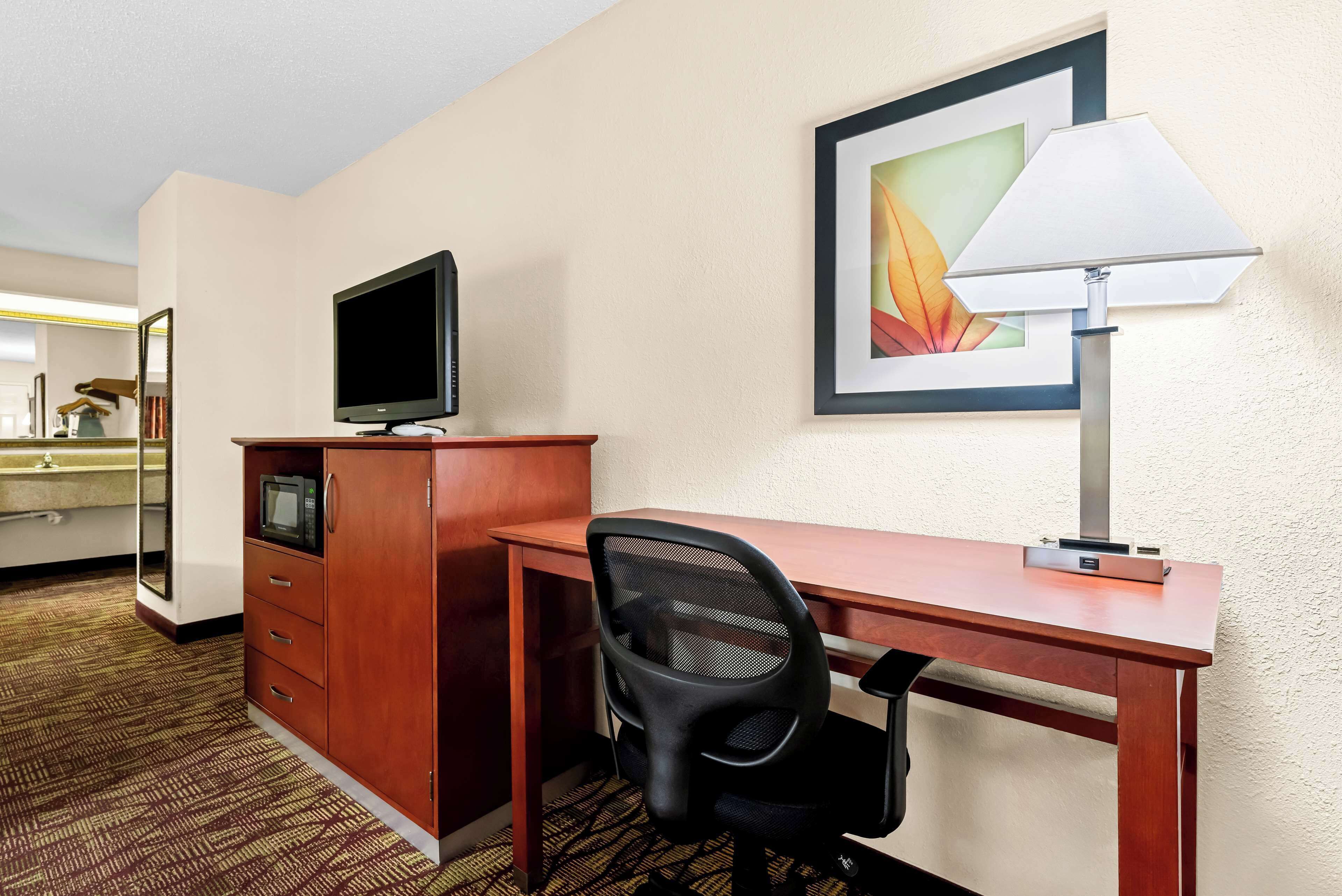 desk, laptop workspace, iron/ironing board, cots/infant beds