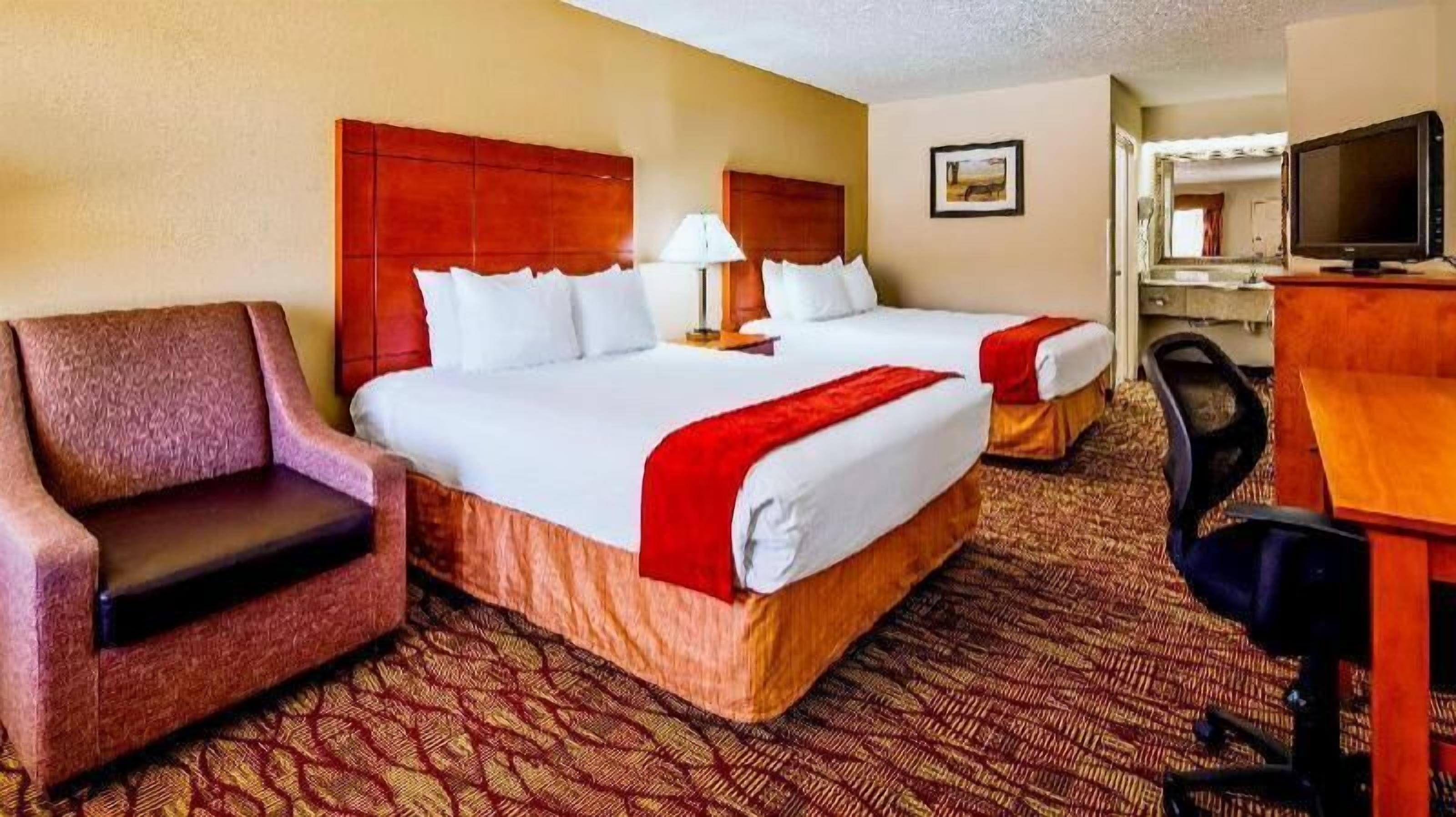 Desk, laptop workspace, iron/ironing board, cribs/infant beds