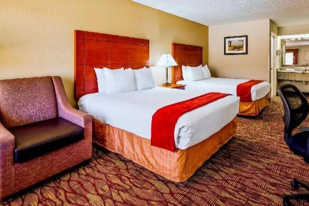 Desk, laptop workspace, iron/ironing board, cribs/infant beds