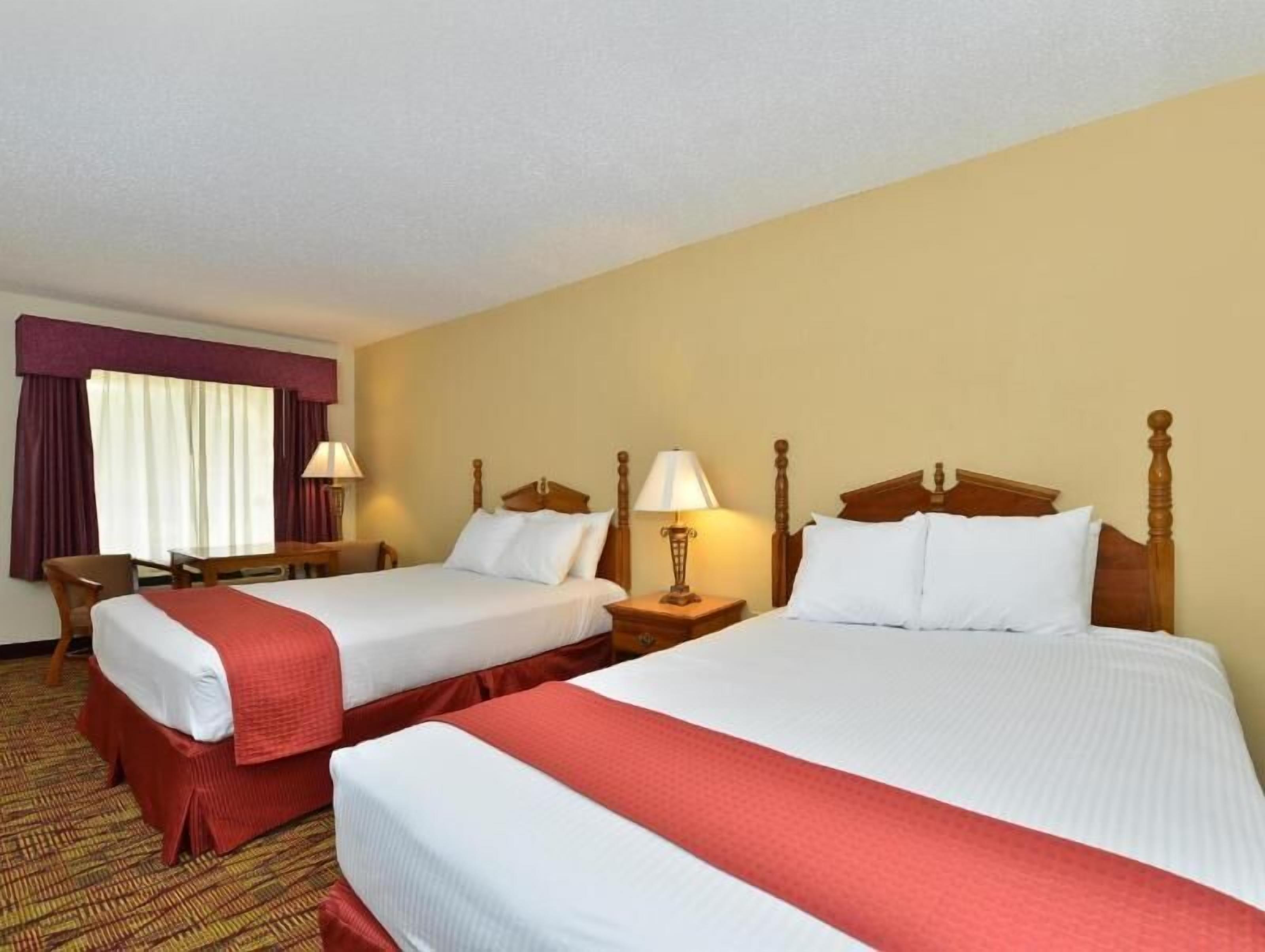 Desk, laptop workspace, iron/ironing board, cribs/infant beds