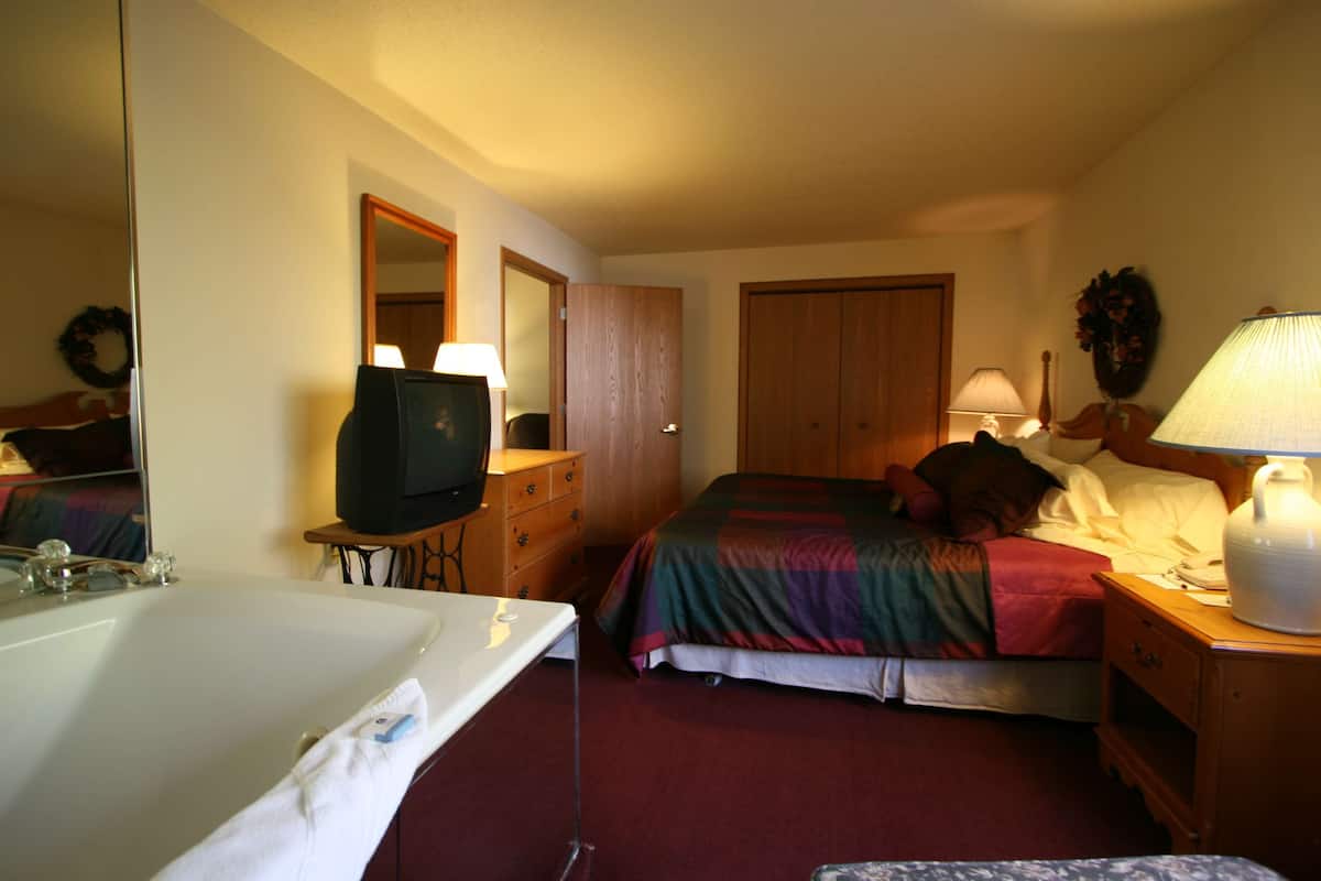 Suite, 1 King Bed, Non Smoking, Jetted Tub (with Sofabed) | Iron/ironing board, WiFi, bed sheets