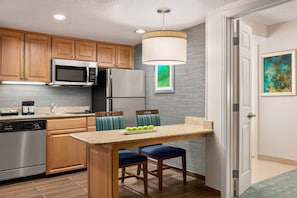 Full-sized fridge, microwave, stovetop, dishwasher