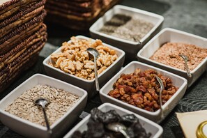 A variety of food items in bowls, including nuts, seeds, and dried fruits. - Hotel Goldenes Schiff (Bad Ischl)