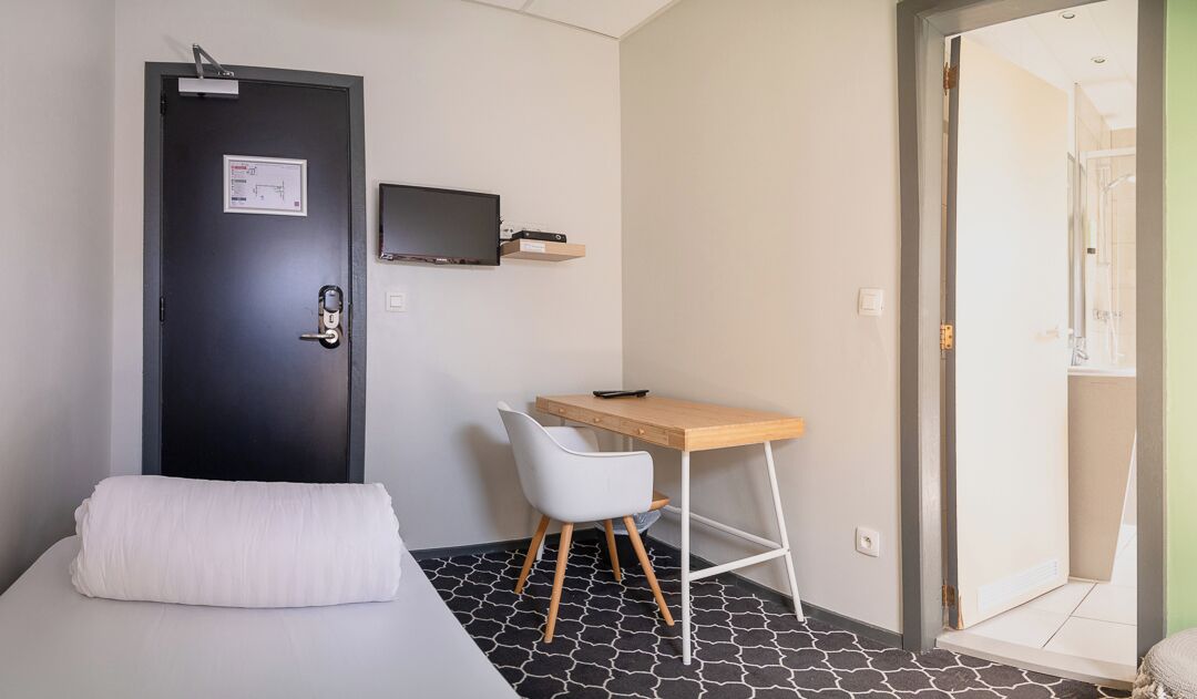 Desk, blackout curtains, free WiFi, bed sheets