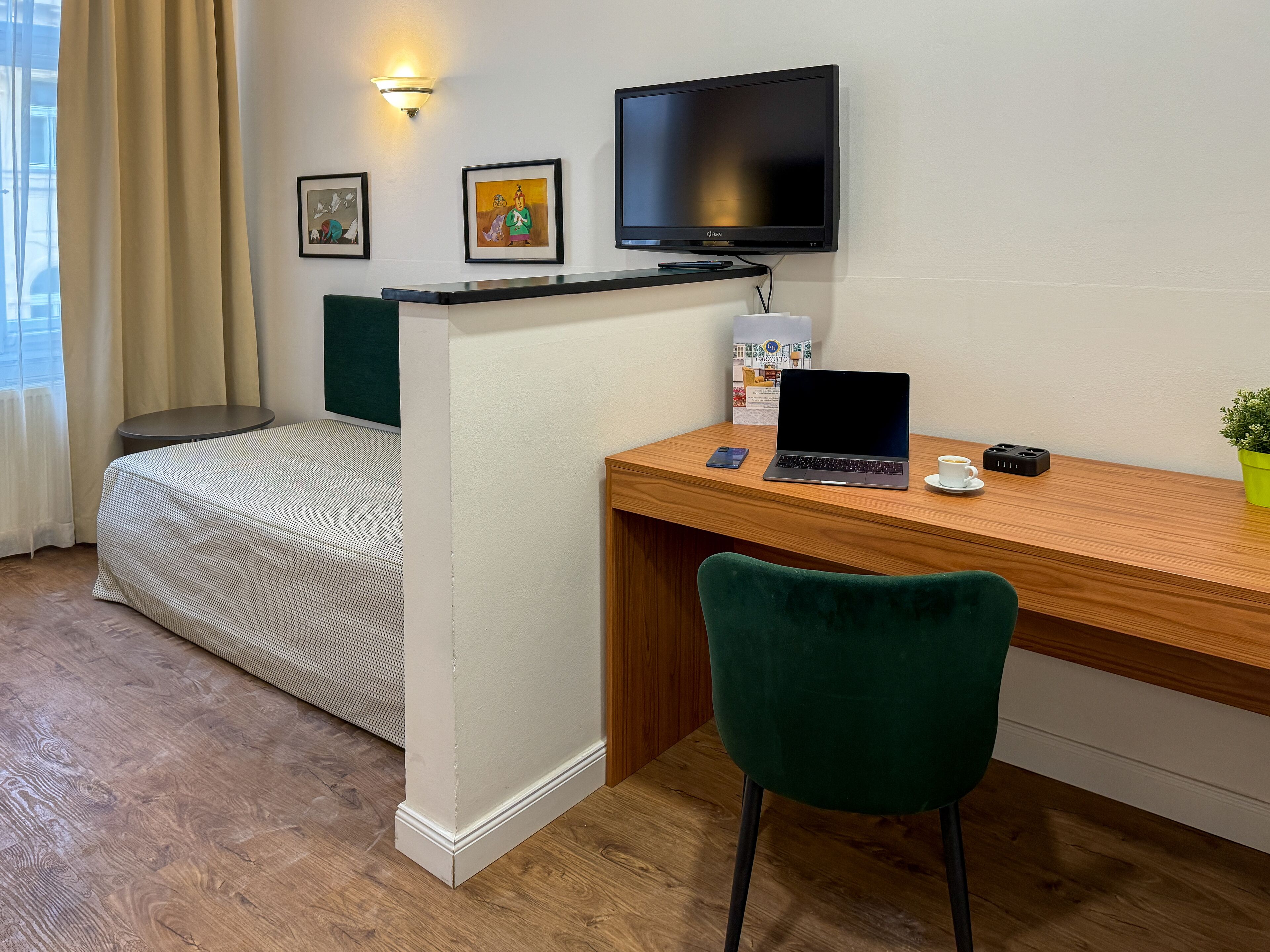 comfort room | in-room safe, desk, blackout curtains, iron/ironing board