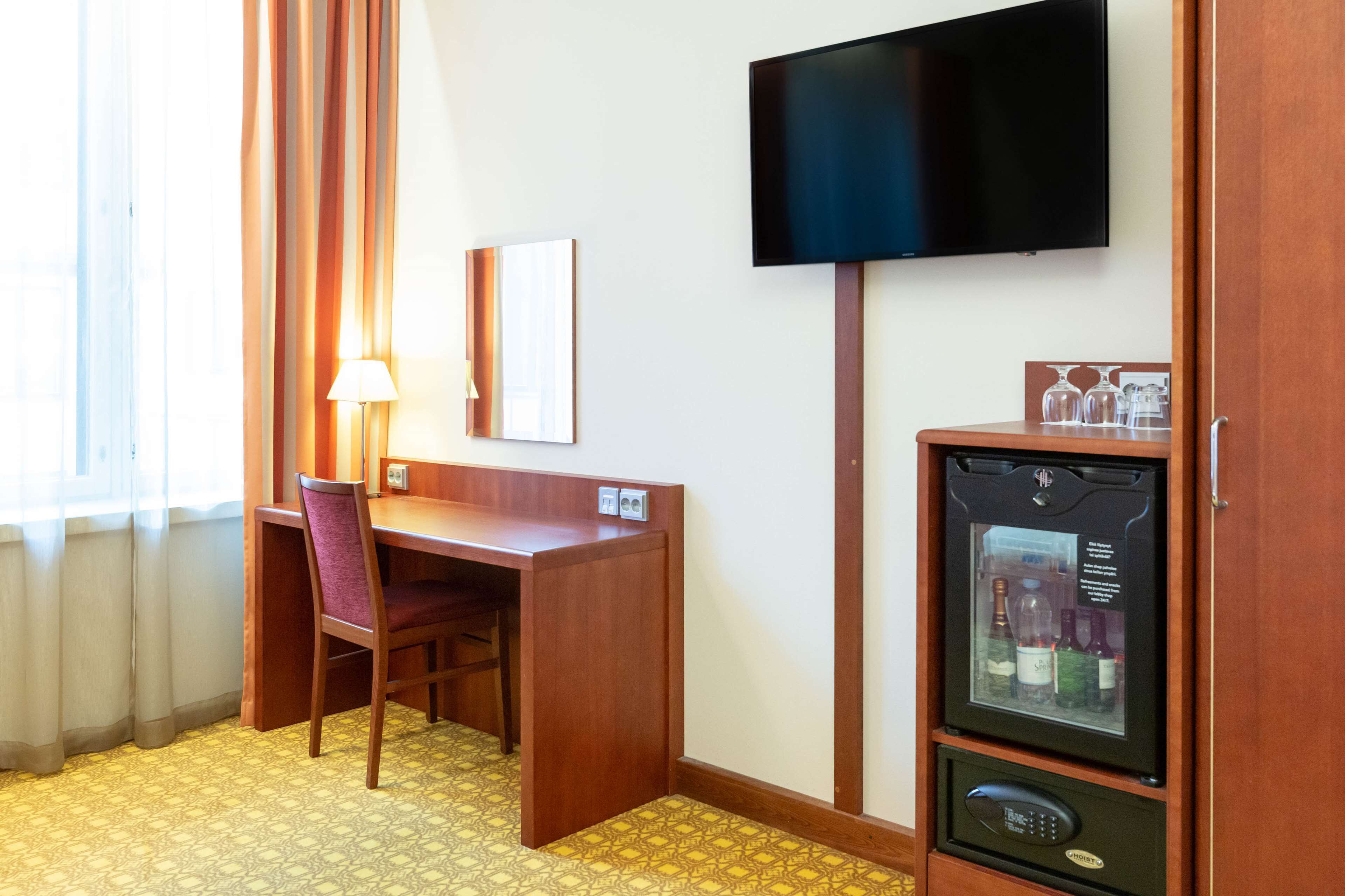 family room | 1 bedroom, minibar, in-room safe, desk