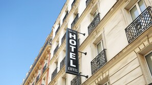 A hotel sign with "NOUVEL HOTEL EIFFEL" written on it. - Nouvel Hotel Eiffel (Paris)
