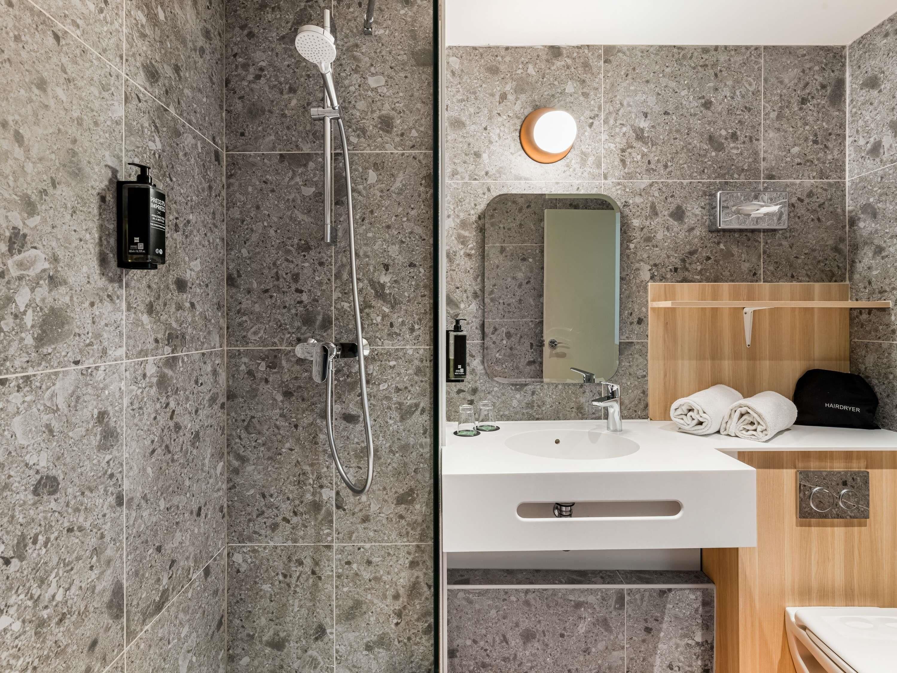 Eco-friendly toiletries, hair dryer, towels