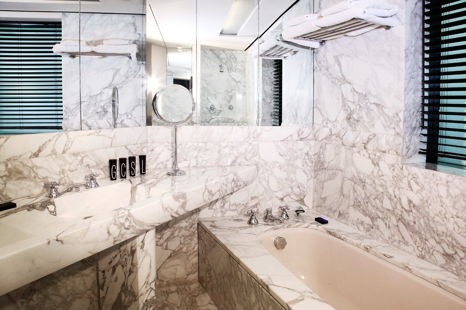 combined shower/bathtub, designer toiletries, hair dryer, bathrobes