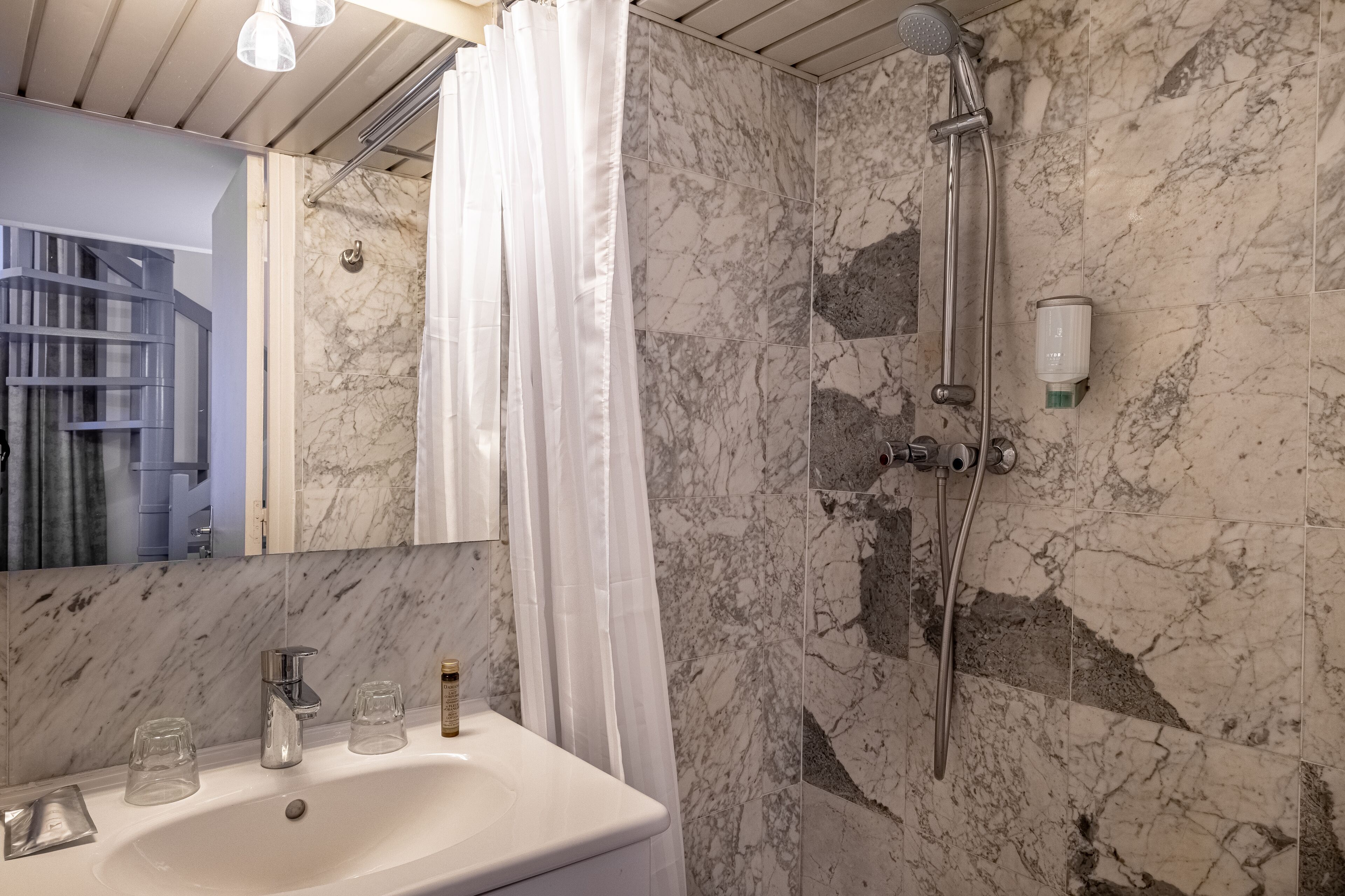 deluxe room | bathroom | bathtub, free toiletries, hair dryer, towels