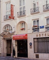 A hotel facade with a prominent 'HOTEL BAUDELAIRE' sign, arched windows, and balconies with flower boxes.