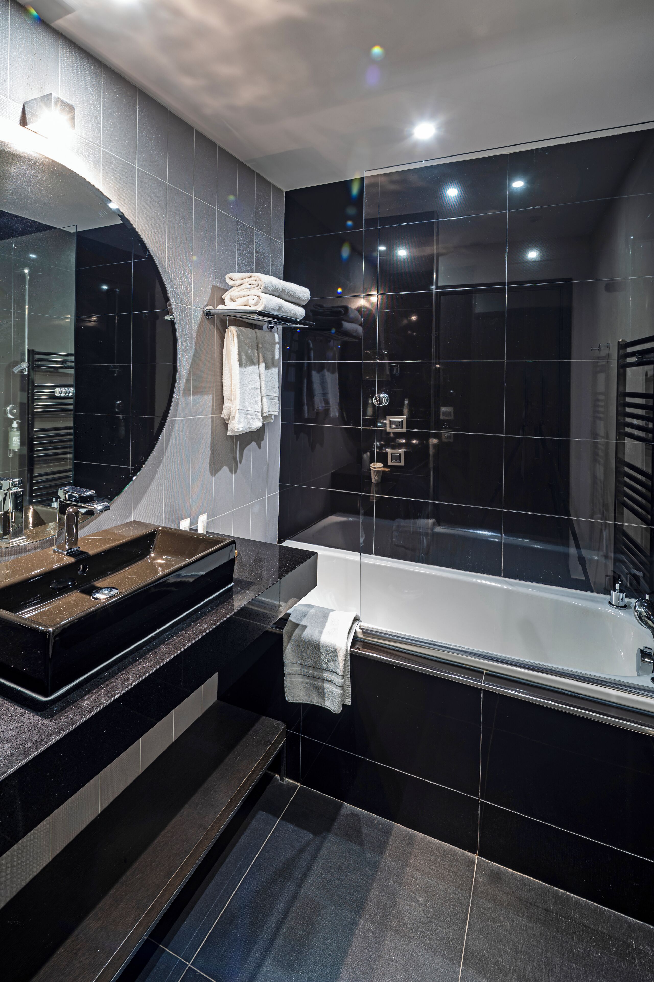 designer toiletries, hair dryer, bathrobes, slippers